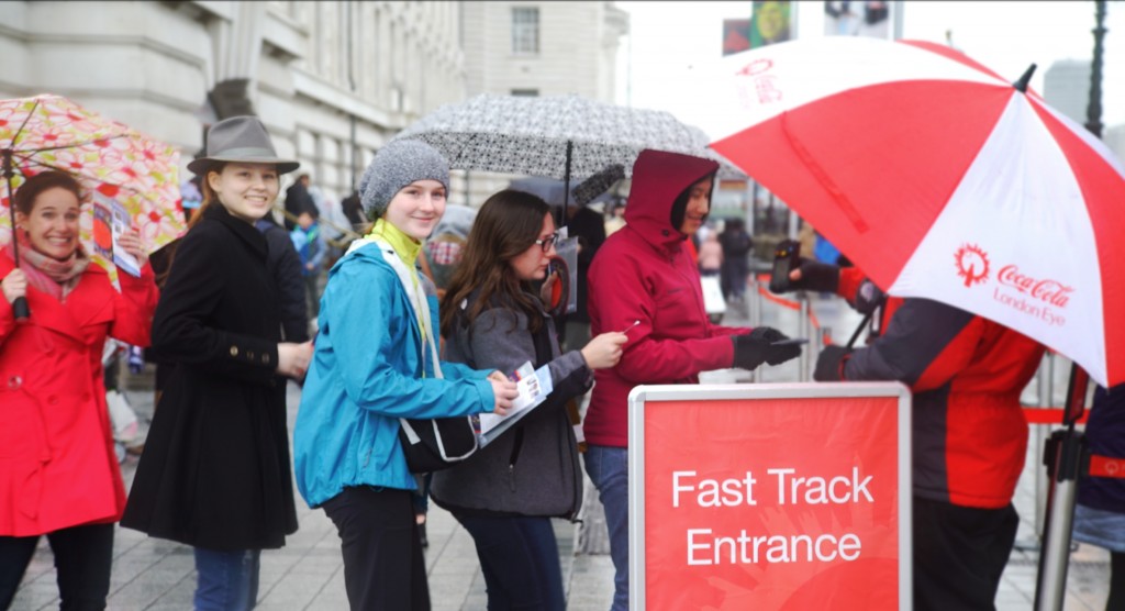 Guests smiling as they skip the lines - even on a rainy day!