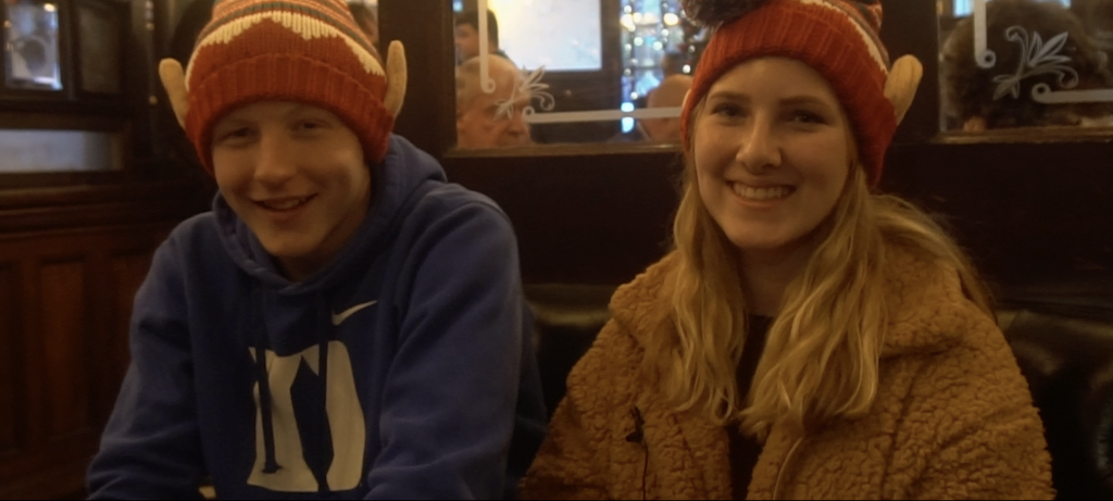 Kids smiling at christmas was christmas hats