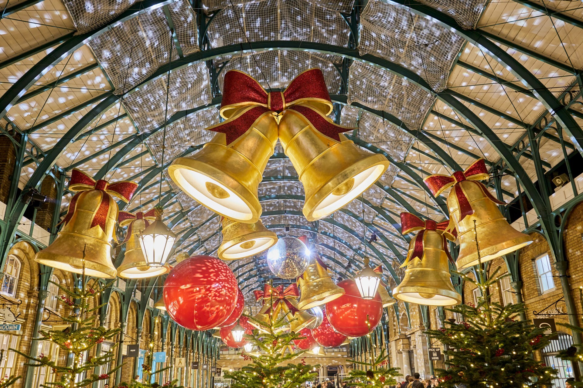 Giant bells and ornaments transform Covent Garden into a magical holiday wonderland.