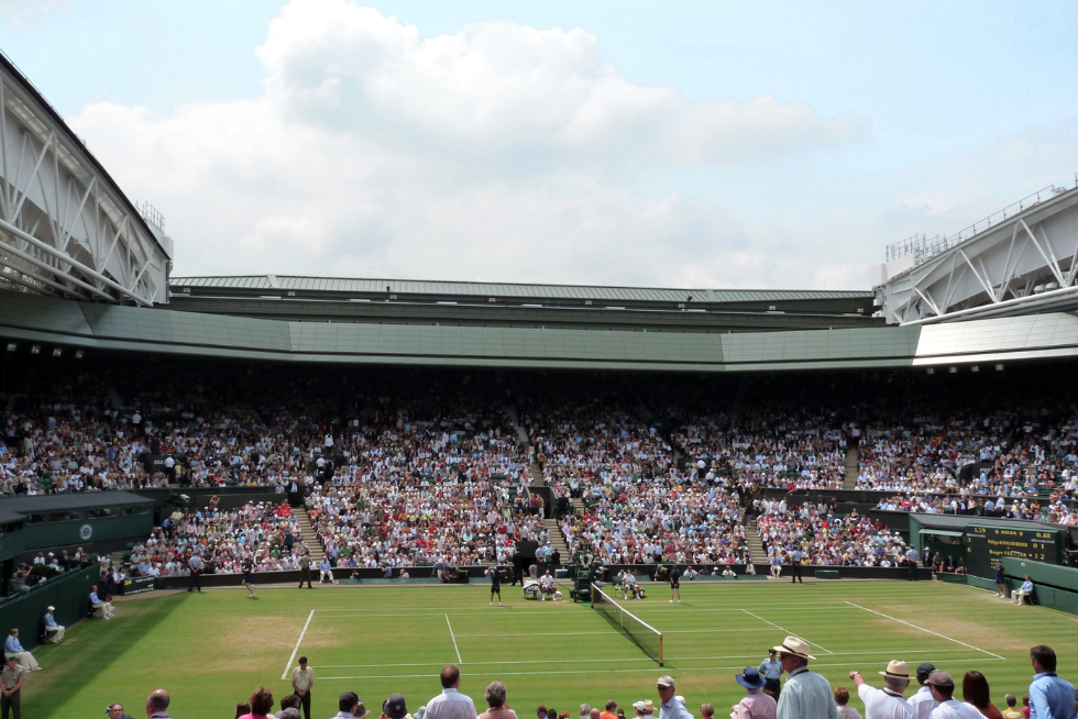 Centre Court at Wimbledon, the most iconic stage in tennis, known for its grass surface, traditions and historic championship matches.