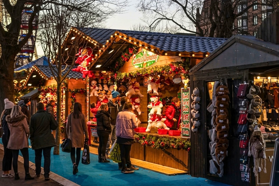 A festive Christmas market filled with seasonal stalls and decorations.